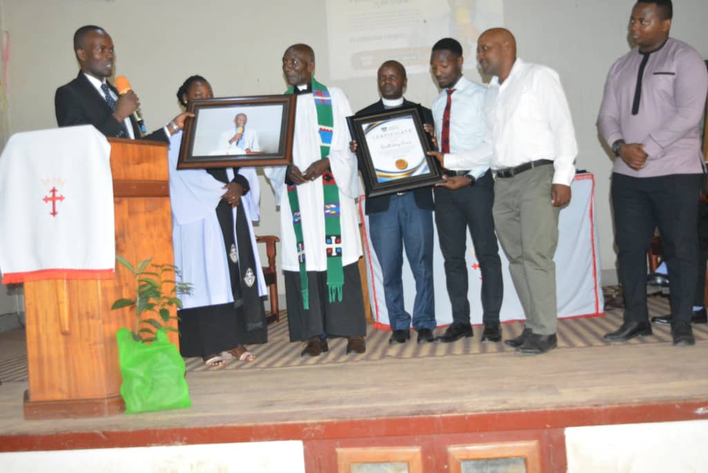 The 20th Guild Government Bidding farewell To Their  Patron Rev. Francis Muhangi during his thanksgiving ceremony and welcoming new Patron Rev. Canon Asaph Kabakyenga